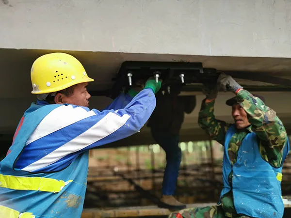 Pre-Tensioned CFRP Plate Prestressing System for Qingshui River Bridge, Henan