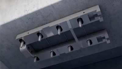 Pre-Tensioned CFRP Plate Prestressing System
